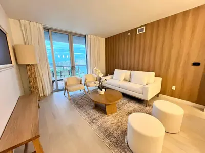 a living room with a couch and a table at 2B 2B Luxury Ocean Views Apt in Hallandale Beach in Hallandale Beach