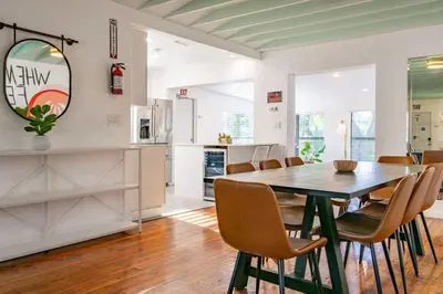 a kitchen and dining room with a table and chairs at Casa Fillmore - Hollywood Oasis in Hollywood