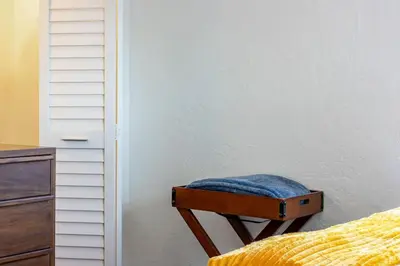 a stool with a blue pillow on it in a bedroom at Casa Fillmore - Hollywood Oasis in Hollywood