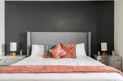a bedroom with a large bed with two night stands at Casa Fillmore - Hollywood Oasis in Hollywood