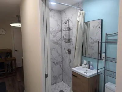 a bathroom with a shower and a sink at Beach Breeze Suite - Steps to the Beach in Hollywood