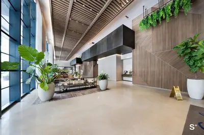 a hallway with potted plants in a building at Stylish 1-BD Condo - City Views in Miami