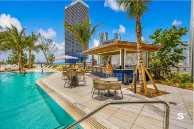 a pool at a resort with a slide at Stylish 1-BD Condo - City Views in Miami