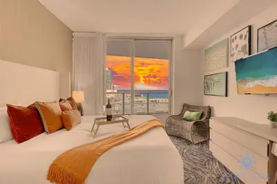 a hotel room with a bed and a window at 2 BR Apartment with Amenities and Balcony in Hollywood
