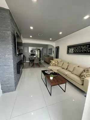 a living room with a couch and a table at Casa Belle 3br W Pool & Bbq 10 Mins To Beach in Miami