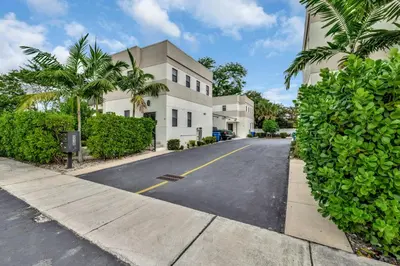 an empty street in front of a building at 3BR 2.5BA Townhome-10 mins to FTL Beach and Downtown in Fort Lauderdale