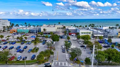 an aerial view of a parking lot next to the ocean at Banyan St 2BR 1BA off Las Olas- Steps to Beach unit 4 in Fort Lauderdale