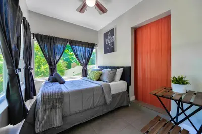 a bedroom with a bed and a window at Comfy & Spacious Duplex w Top Amenities! in Miami