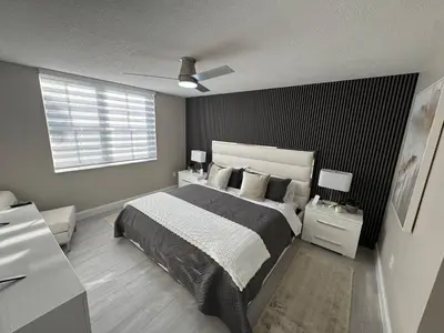 a bedroom with a large bed and a window at Urban Luxe Aventura 22 Retreat in Aventura