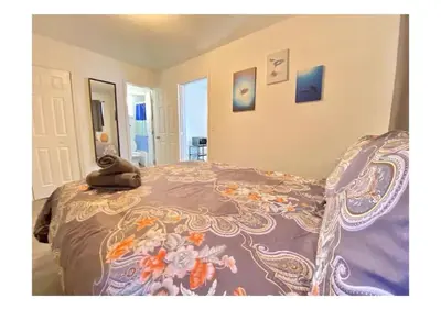 a bedroom with a bed with a colorful blanket at Cozy Place Near Design District - 2 in Miami