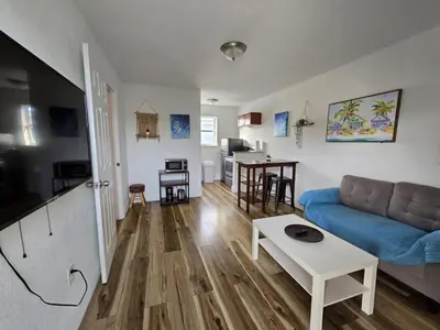 a living room with a couch and a table at Cozy Place Near Design District - 4 in Miami