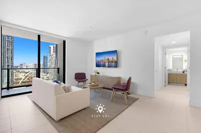 a living room with a couch and chairs and a large window at Modern Stylish Apt 2BR-2BTH in Miami