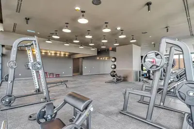 a gym with several exercise equipment in a room at Best Stay - City Views Gym & Pool in Miami