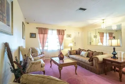 a living room with a couch and a coffee table at Oasis1080 Resort in Plantation