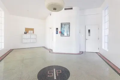 a large white room with a rug on the floor at Convention Center in Miami Beach