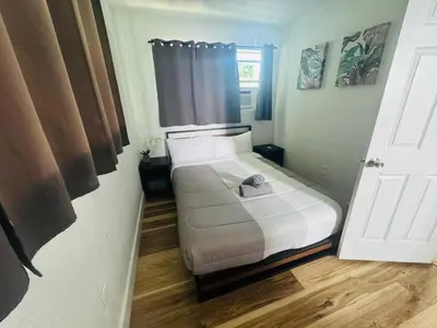 a small bedroom with a bed in a room at Cozy place Near Design District - 1 in Miami