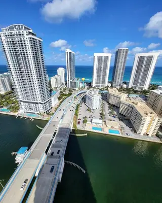 a bridge over the water in a city with tall buildings at Luxury Apt with Ocean View in Hallandale in Hallandale Beach
