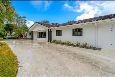 a house with a driveway in front of it at Opulent Home with Sauna & Pool in Hollywood