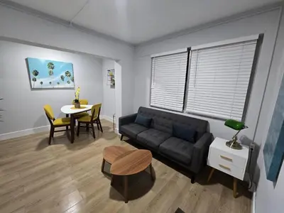 a living room with a couch and a table at Miami Urban Oasis - B in Miami