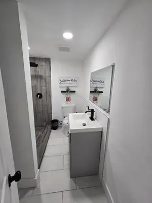 a white bathroom with a sink and a toilet at Miami Urban Oasis - B in Miami