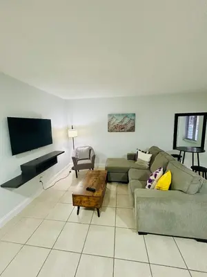 a living room with a couch and a coffee table at Apartment in Hollywood close to shops & beach 108 in Hollywood