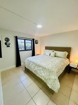 a bedroom with a large bed and a window at Apartment in Hollywood close to shops & beach 108 in Hollywood