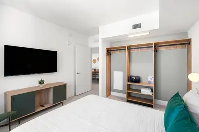 a living room with a flat screen tv on a wall at New 26th floor amazing view 2BR-2BA in Miami