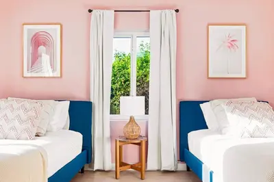 a bedroom with two beds and a window at Lux 6BR Villa with Pool, King Beds and Top Amenities in Miami