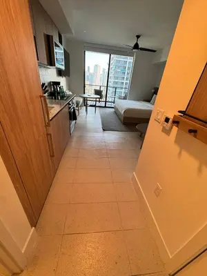 a view of a kitchen and a living room at NEW Suite Downtown Miami - Amazing view 27th floor in Miami