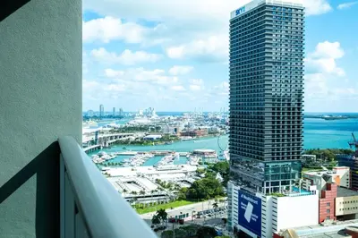 a view of a city with a tall skyscraper at NEW Suite Downtown Miami - Amazing view 27th floor in Miami