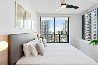 a bedroom with a bed with a large window at Stunning Views Dwntwn Miami 2BR Unit - Floor 28th in Miami