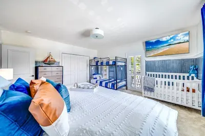 a baby room with a crib and a baby crib at 5BR Luxury Mins to Las Olas, Shops and Beach in Fort Lauderdale