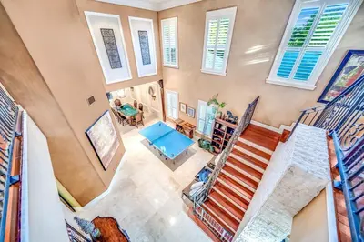 an overhead view of a staircase in a home with windows at 5BR Luxury Mins to Las Olas, Shops and Beach in Fort Lauderdale