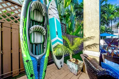 two surfboards are leaned up against a wall at 5BR Luxury Mins to Las Olas, Shops and Beach in Fort Lauderdale