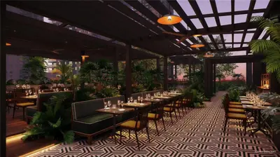 a restaurant with tables and chairs and plants at Stylish Studio - Amazing Amenities & Pool in Miami