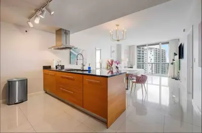 a kitchen with a sink and a counter top at Icon Brickell Amazing Ocean View in Miami