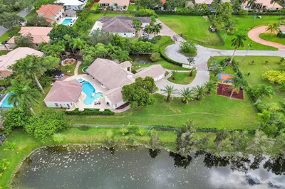 an aerial view of a house with a swimming pool at The Grand Luxe 8BR Villa w POOL and basketball in Pembroke Pines