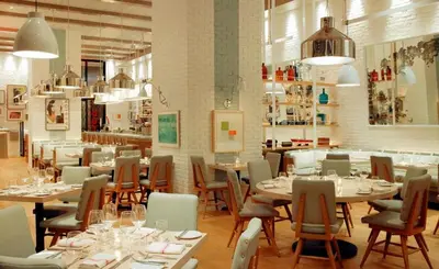 a dining room with tables and chairs in a restaurant at SOUTH BEACH Stunning Studio in Miami Beach