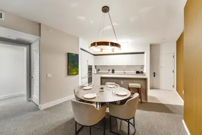 a kitchen and dining room with a table and chairs at Condo w Breathtaking Views & Top Amenities in Hollywood