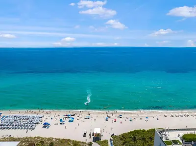 an aerial view of a beach with a group of people at Condo w Breathtaking Views & Top Amenities in Hollywood