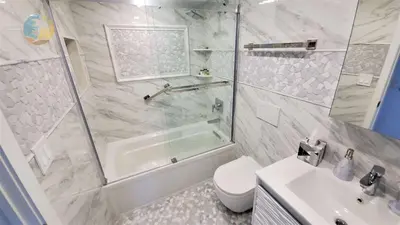a bathroom with a shower and a toilet and a sink at Alexander 1001 in Miami Beach