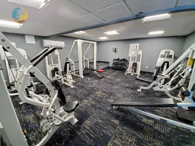 a gym with several treadmills and tread machines at Alexander 1001 in Miami Beach
