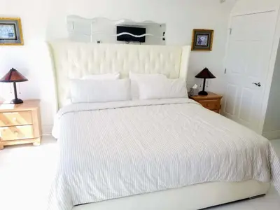 a white bed with white sheets and pillows at Alexander 1101 in Miami Beach