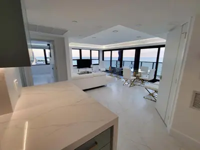 a large white room with a living room with a view of the ocean at Alexander 1102 in Miami Beach
