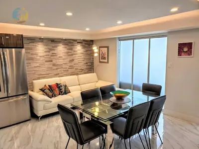 a living room with a couch and a table and chairs at Alexander 1103 in Miami Beach