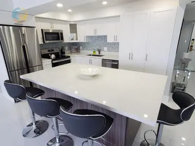 a kitchen with a white counter and black appliances at Alexander 1104 in Miami Beach
