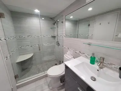a bathroom with a shower and a toilet and a sink at Alexander 1121 in Miami Beach