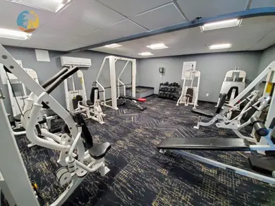 a gym with several treadmills and tread machines at Alexander 1121 in Miami Beach