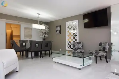 a living room with a table and a dining room at Alexander 1121 in Miami Beach