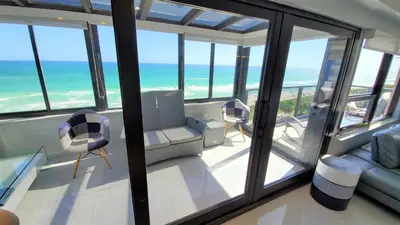 a living room with a view of the ocean at Alexander 1401 in Miami Beach